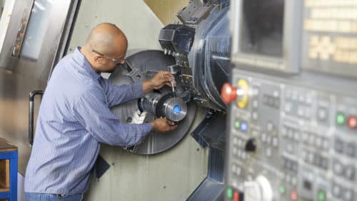 man working on machinery